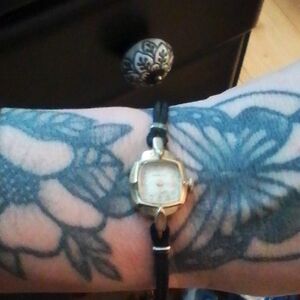 Bulova Women's Gold and Black Watch